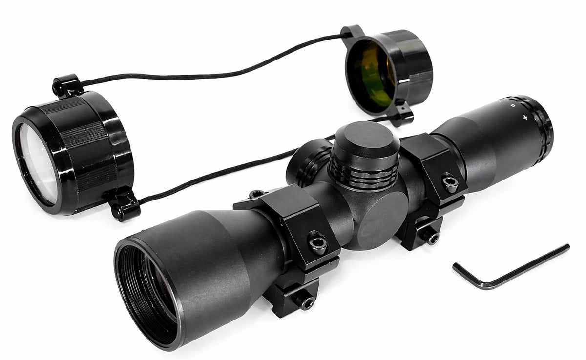 Black rifle scope with attached light on a white background