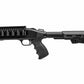 A black tactical shotgun with a vertical foregrip, adjustable stock, and a rail-mounted accessory, shown in profile against a white background.