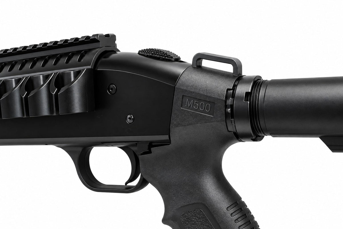 Close-up of a black tactical-style firearm or airsoft rifle component with a long barrel, handguard, and textured grip on a white background. The side shows the model marking 'M500'.