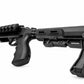 A black tactical shotgun with a textured, rugged stock and a mounted rail system, shown from a side profile on a white background.