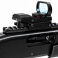 Close-up of a black tactical rifle scope mounted on a black shotgun stock, shown against a plain white background.