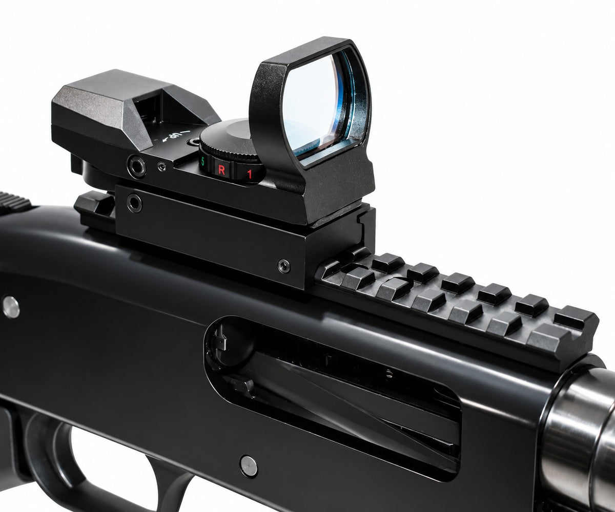 Close-up of a black tactical red dot sight mounted on a black rifle receiver, shown against a plain white background.