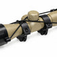 TRINITY 4x32 Mil-Dot scope in tan with blue multi-coated objective lens, aluminum housing, adjustment turrets, and black dovetail mounting rings on a white background.