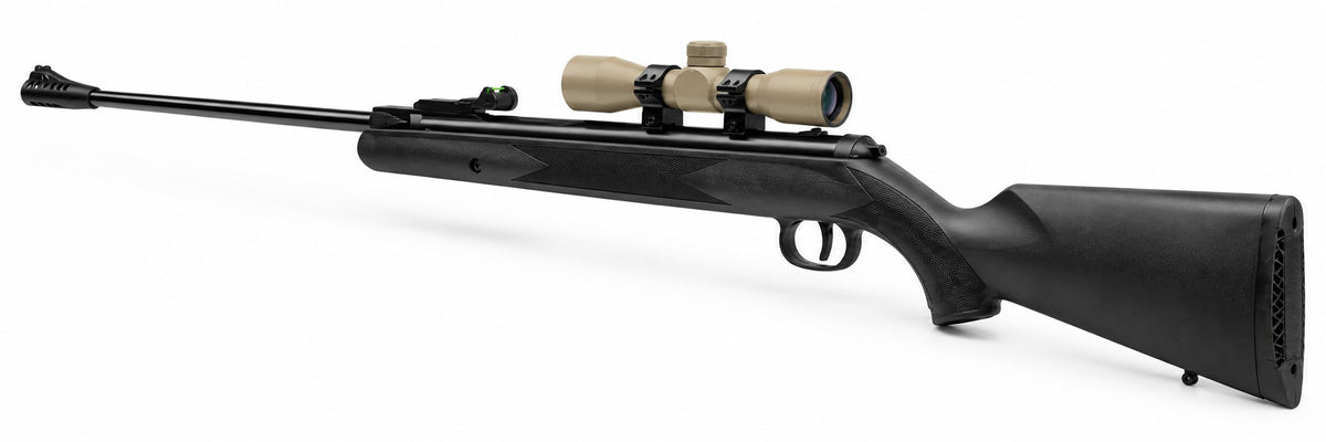 TRINITY 4x32 Mil-Dot scope in tan with blue multi-coated objective lens, aluminum housing, adjustment turrets, and black dovetail mounting rings on a white background.