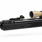 TRINITY 4x32 Mil-Dot scope in tan with blue multi-coated objective lens, aluminum housing, adjustment turrets, and black dovetail mounting rings on a white background.