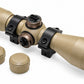TRINITY 4x32 Mil-Dot scope in tan with blue multi-coated objective lens, aluminum housing, adjustment turrets, and black dovetail mounting rings on a white background.
